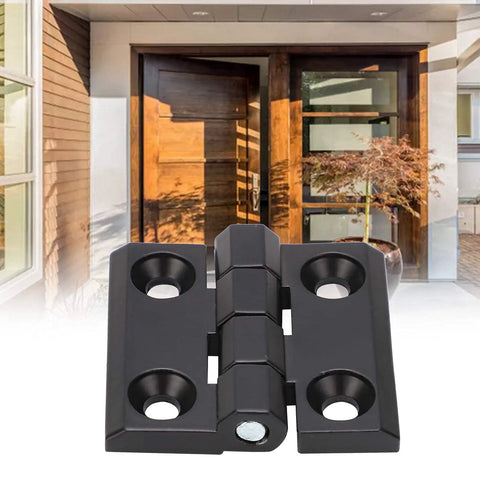 Zinc Alloy Door Switch Hinge With Double Spring 39x40mm, black finish, screw mount displayed in front of wooden door