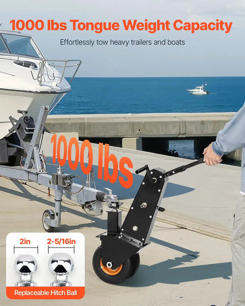 Heavy Duty Trailer Dolly With 1000 Lb Tongue Weight Support swappable hitch balls on pneumatic tires near boat ramp.