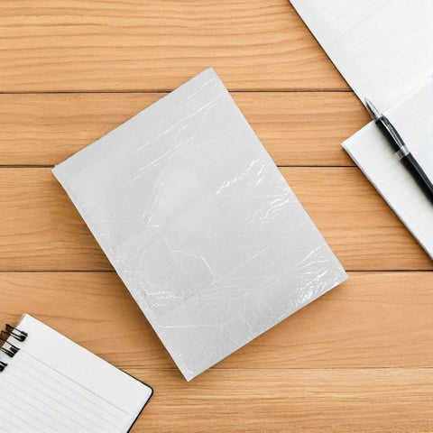 Waterproof Bubble Mailers 10 Pack Self Seal Padded Envelopes 40x50 CM on wooden desk with notepads