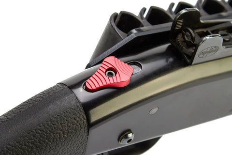 Close-up of Drop In Aluminum Safety Upgrade With Ball And Steel Plate For Mossberg Shotguns 12 And 20 Gauge 500 590 835 940 88 Red