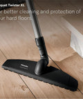 Premium Bagged Canister Vacuum For Hard Floors And Thin Carpet Featuring XL Parquet Brush Universal Floorhead Footswitch Hygienic Air Filter For Badass Suction And Slick Cleanup on wooden floor
