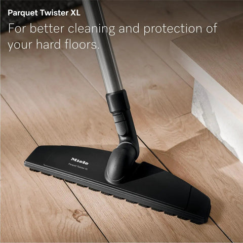 Premium Bagged Canister Vacuum For Hard Floors And Thin Carpet Featuring XL Parquet Brush Universal Floorhead Footswitch Hygienic Air Filter For Badass Suction And Slick Cleanup on wooden floor