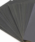 Heavy Duty Sandpaper Sheets For Wood And Metal Projects Super Grippy Silicon Carbide Grip in a stack, ideal for wet dry sanding.