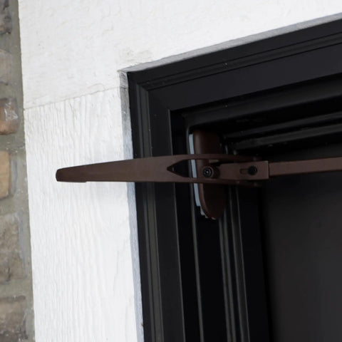 Heavy Duty Adjustable Front Door Garland Hanger with Padded Ends providing solid grip on door jambs, mounted at 51 inches.