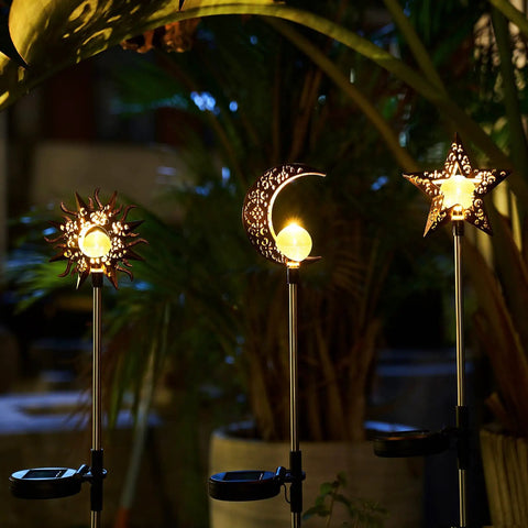Celestial Solar Garden Stakes Set With Moon Sun Star Lights for Lawn Pathway and Flower Beds, 3 pack glowing at night