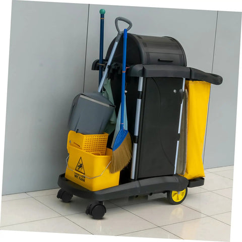 Cleaning cart with mop, broom, yellow caution sign, and bucket on swivel caster wheels in a modern space.