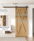 Six Point Six Feet Long Sliding Barn Door Hardware Kit For Single Door Sturdy Durable Carbon Steel With Black Coating To Prevent Rust Heavy Duty Easy To Install Fits Thirty Six To Forty Inch Wide Doors J Shape Hanger Included installed on wooden door, showing rail and measurements.