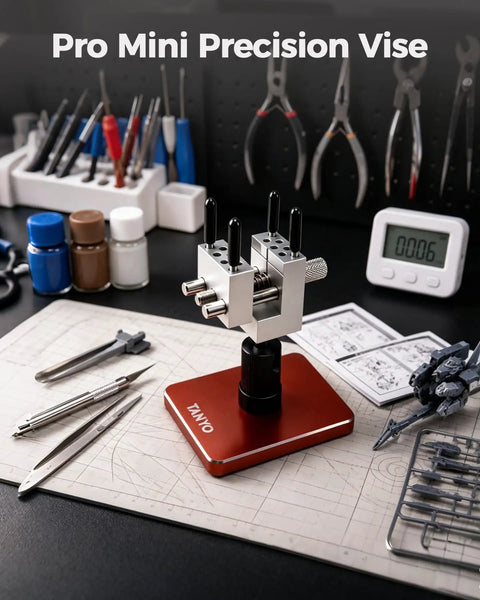 Slick Mini Bench Vise Featuring Sweet 360 Degree Rotating Ball Joint Base, Legit Aluminum Alloy Table Top Hobby Clamp Offering Flexible Multi Angle Tilting And Secure Grip For Gunpla Assembly Jewelry Repair Electronics Soldering Work, Rich Red on a workshop desk.