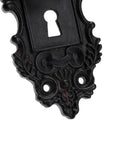Close-up of black vintage keyhole plate with ornate design for Two Piece Vintage Cabinet Pull Drawer Knob Set With Clear Resin Knob