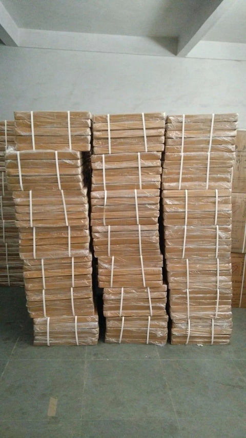 Stacks of tan ceramic fiber insulation boards, 1 in thick, 18 x 24 in, bound in plastic.