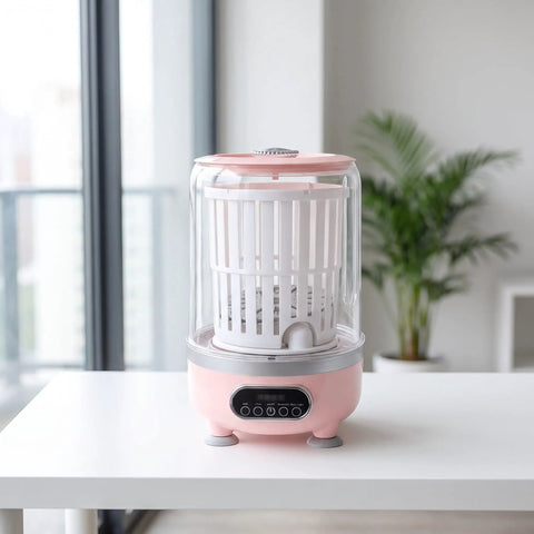 Zero Drama Portable Usb Rechargeable Mini Underwear Washer Slick Compact 3L Personal Turbo Laundry Machine in pink color on a table.