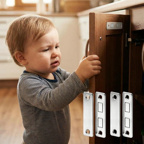 Child near cabinet secured with No Drill Magnetic Cabinet Door Catch Set With Heavy Duty Stainless Steel Latches