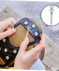 Person assembling Lawn Aerator Shoes With Heavy Duty Metal Spikes 5.8 CM Set Of 20 Pegs, focusing on spike attachment.