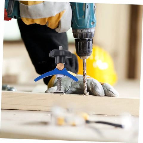 Heavy Duty Track Hold Down Clamp For Woodworking And Carpentry used with a drill on a wooden board in a workshop setting