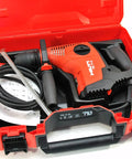 Beast 120V Rotary Hammer Drill Kit TE 7-C With D-Grip in red carrying case, showing ergonomic handle and accessories.