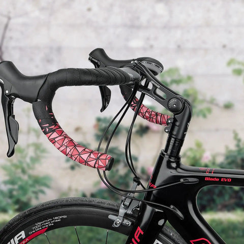 Close-up of 130 Degree Adjustable Dialed In Bicycle Stem with 31.8mm handlebars and pink tape on a black road bike.