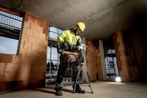 Pro Grade 18 Volt Cordless Angle Grinder With Brushless Motor And Quick Change Spindle for heavy duty metal cutting at a jobsite.