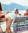 Inflatable Boom Box Beverage Cooler For Retro 80s 90s Parties at lakeside, filled with drinks, open on picnic table, vintage theme.