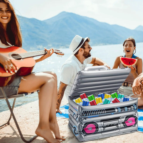 Inflatable Boom Box Beverage Cooler For Retro 80s 90s Parties at lakeside, filled with drinks, open on picnic table, vintage theme.