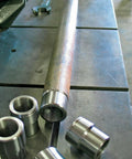 Heavy Duty Chromoly Half Inch Heim Joint Kit For Utvs Suspension And Rock Crawling with one inch weld bungs and tie rod ends on a workbench.