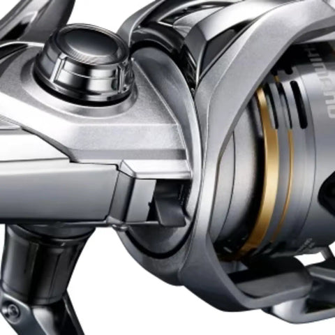 Close-up of Sedona C5000XG spinning reel with 24.3 lbs max drag and 13.3 lbs practical drag, showcasing metallic spool and frame design.