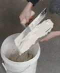Person using Carbon Steel Drywall Trowel Set With Lightweight Wood Handles Includes 14x4, 12x4, 8x3 Inch Masonry Plastering Trowels