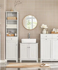 Bathroom with slim tilt-out laundry hamper cabinet for tight spaces, white finish, narrow pull-out storage unit, shelving and drawers.