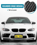 Legit Real Carbon Fiber License Plate Frame With Glossy 3D Twill Finish For Cars And Trucks on a white sedan with rounded edge design.
