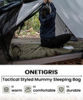 Person setting up tent with 3-Season Mummy Sleeping Bag For Camping, Hiking, And Backpacking With Water-Repellent Shell in forest