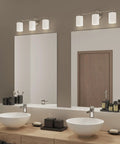 Three Light Etched Glass Modern Bath Vanity Light in Polished Nickel Finish, Replay Collection, Indoor Use in sleek bathroom setting