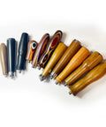 Collection of wood and metal handles for 58mm Bottomless Portafilter with various shapes and colors, barista accessory.