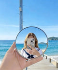 Handheld Convex Mirror Set Portable Shatter Resistant Lens Create Wide Angle Photos on beach with reflection in sunny weather.