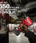 M12 FUEL Stubby 3/8 Inch Impact Wrench Bare Tool in use providing up to 550 ft-lbs nut-busting torque in auto shop