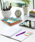 Slick Microfiber Leather Valet Tray For Nightstand And Desk on a table, featuring a cartoon car grid print with papers.