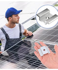 Man installing solar panels using Bulk 42 Pack Aluminum Solar Panel Mid Clamps For Mounting On Tin Roof Flat Roof And Sheet Roofs Silver Finish Heavy Duty Brackets Kit For Easy Solar Panel Installation