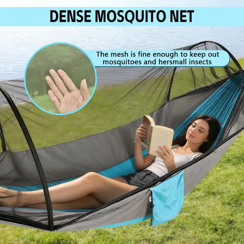 Camping Hammock With Integrated Mosquito Net For Double Or Single Use showing close-up of netting and user reclining