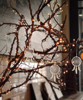 Wooden Dream Catchers DIY Kit With Hollow Design 50 Pcs Boho Style Wood Pendants For Creative Activities And Bedroom Wall Decor Fun Craft Supplies For Painting Crafting And Kids Projects, hanging white dream catchers on lit branches