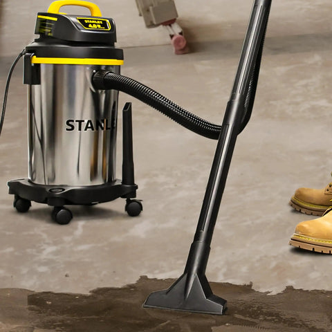 Heavy Duty Wet And Dry Vacuum Cleaner With 4 Gallon Tank And 4 HP Power, Stainless Steel Canister in use in a workshop