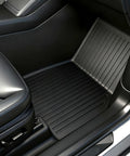 Tesla Model Y Juniper All Weather Floor Mats And Cargo Liners 9 Piece CabinProtect Pro Kit installed in passenger footwell