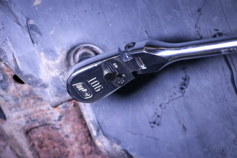 Four Piece Ratchet Set With Flexible Head And 90-Tooth Full Polish Finish For Tight Spots in use on machinery