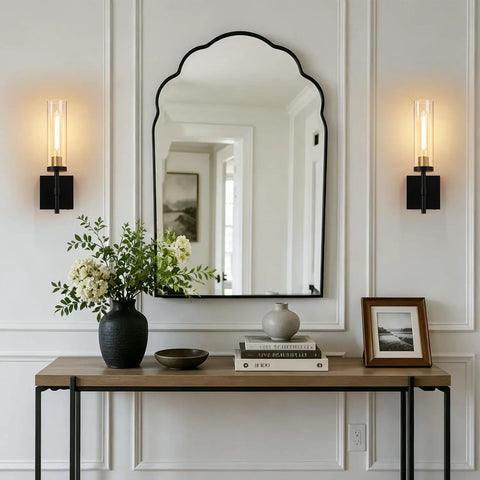 Plug And Play Wireless Wall Sconces With Smart Remote Control And Massive 10000Mah Battery Dimmable Rechargeable Lighting Set Of Two sleek black and gold fixtures beside a decorative mirror.