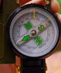 Close-up of Dope Outdoor Compass For Camping And Hiking Your Go To Orienteering Tool For Accurate Navigation Wilderness Survival And Adventure Folding Metal Cover And Floating Dial.