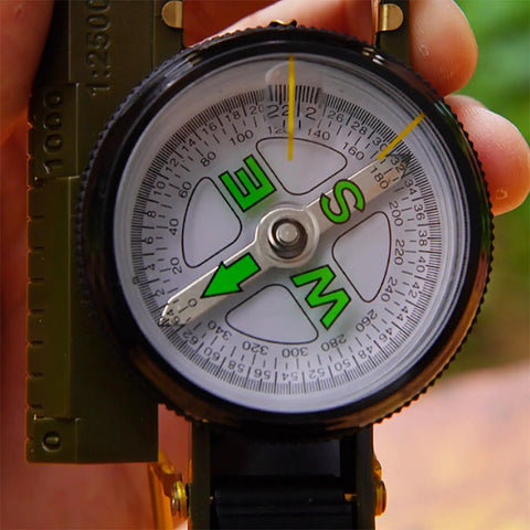 Close-up of Dope Outdoor Compass For Camping And Hiking Your Go To Orienteering Tool For Accurate Navigation Wilderness Survival And Adventure Folding Metal Cover And Floating Dial.