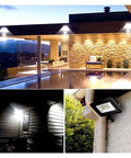 JUDYSSY Pir Motion Sensor Led Flood Light Waterproof Spotlights 30W 50W 100W Wall Lamp on modern house exterior at night.