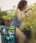Woman using Heavy Duty Garden Kneeler And Seat With Wide Cushioned Pad Foldable Patio Bench Stool With Dual Tool Bags Portable Kneeling Chair For Gardening Perfect Gift For Gardeners, shown in a garden setting with tool bags visible.