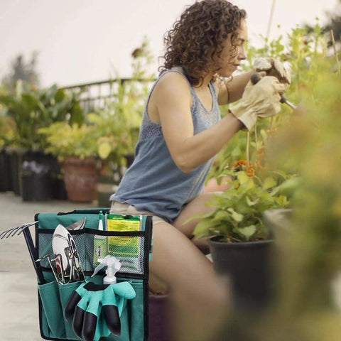 Woman using Heavy Duty Garden Kneeler And Seat With Wide Cushioned Pad Foldable Patio Bench Stool With Dual Tool Bags Portable Kneeling Chair For Gardening Perfect Gift For Gardeners, shown in a garden setting with tool bags visible.
