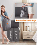 Woman holding bag from Big Ol Double Laundry Hamper With Lid And Removable Bags, Large Collapsible Two-Section Laundry Basket in Gray.