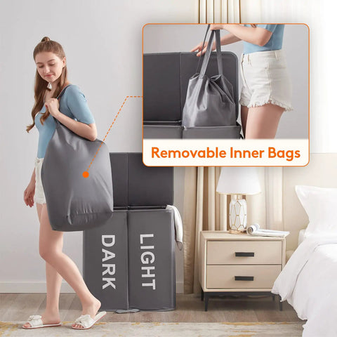 Woman holding bag from Big Ol Double Laundry Hamper With Lid And Removable Bags, Large Collapsible Two-Section Laundry Basket in Gray.
