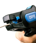 Close-up of Automatic Wire Stripper And Cutter With Narrow Profile For Tight Spaces, Self Adjusting Blades For 24-10 AWG, held in hand
