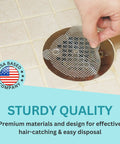 Hand applying Disposable Shower Drain Hair Catcher Mesh Stickers Peel And Stick Drain Strainers To Prevent Clogs adhesive.